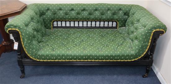 A late Victorian ebonised settee L.154cm